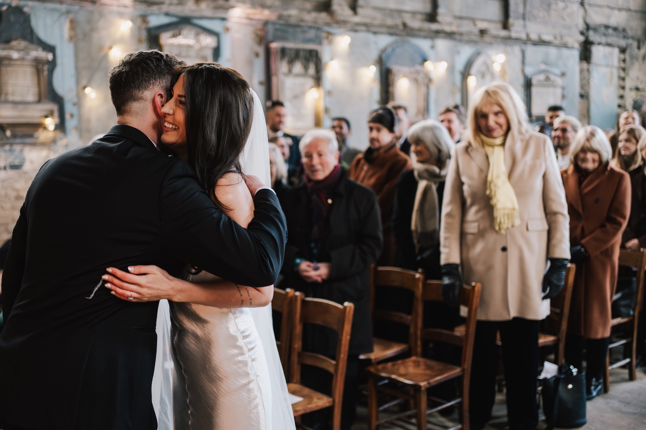 guests standing at a wedding ceremony